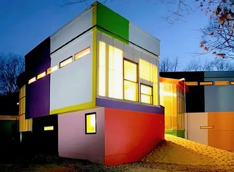 a multicolored building with a door open