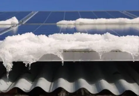 snow on the roof of a building