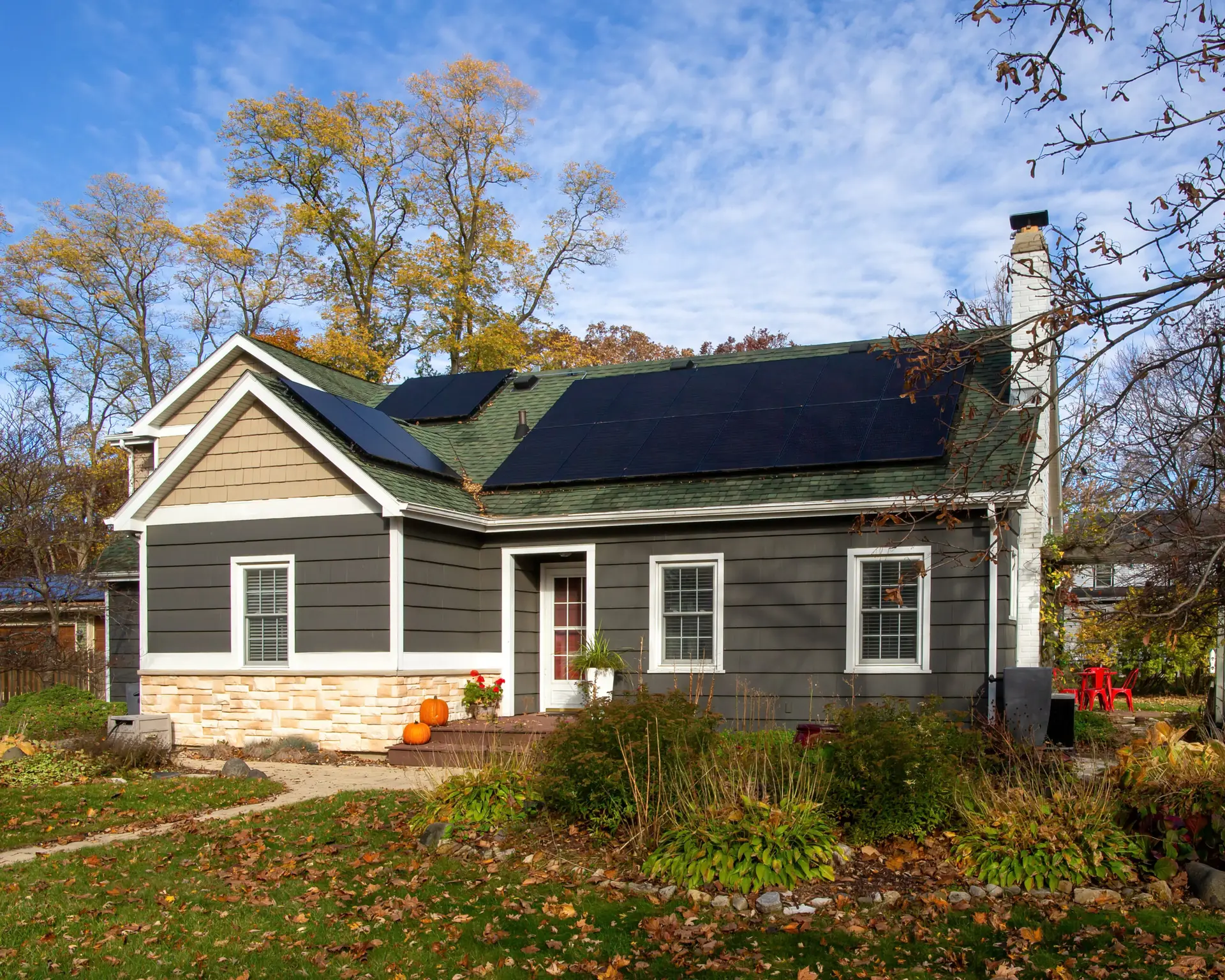 a house with a solar panel on the roof