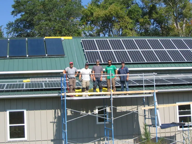 a group of men standing on scaffolding