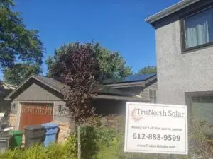 a house with a sign in front of it