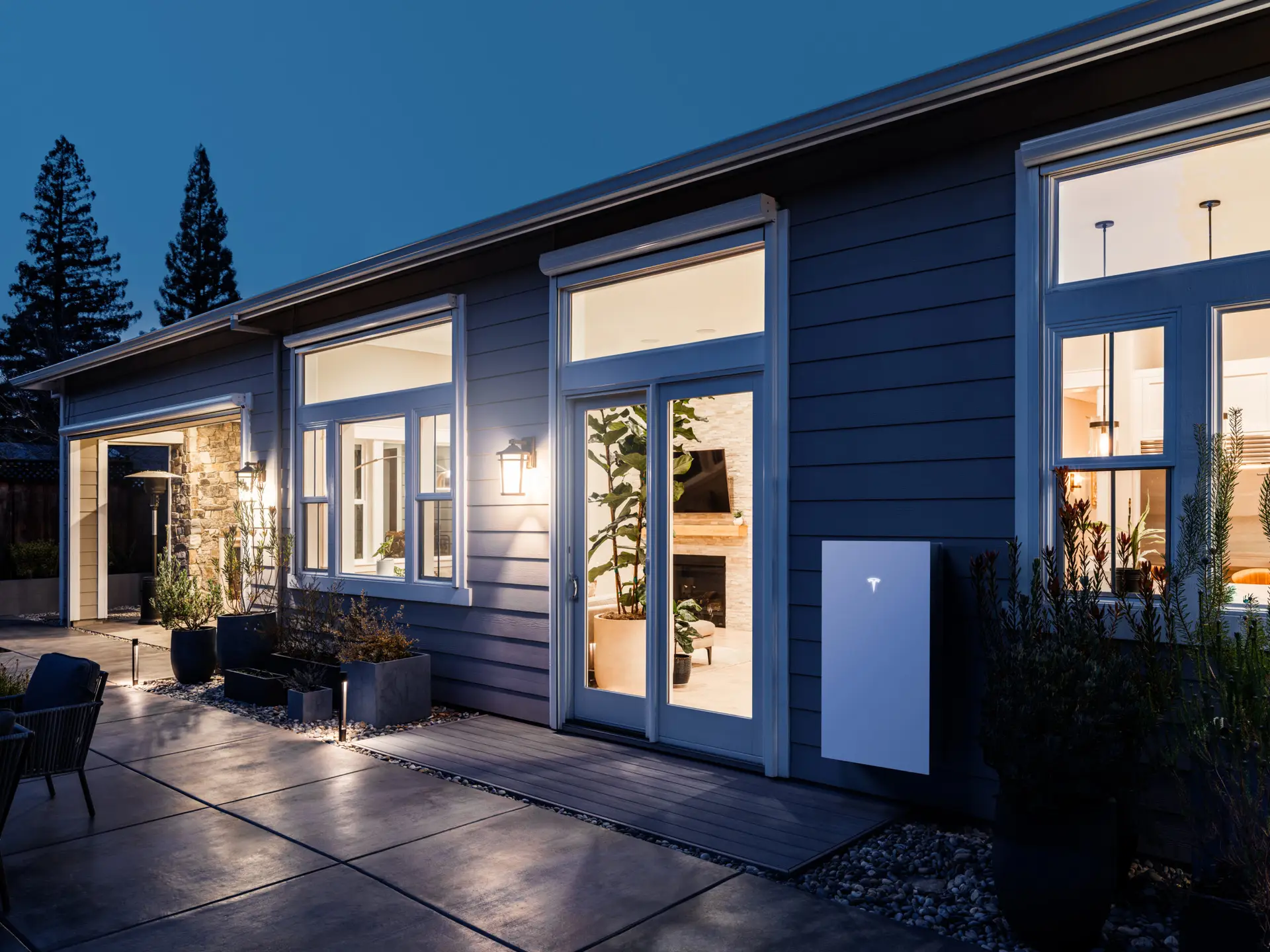 a house with a patio and a stone walkway