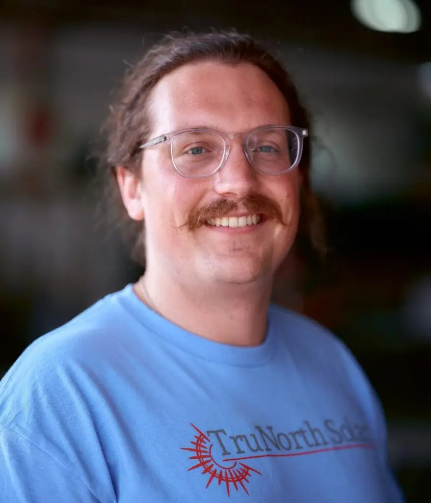 a man with a mustache and glasses