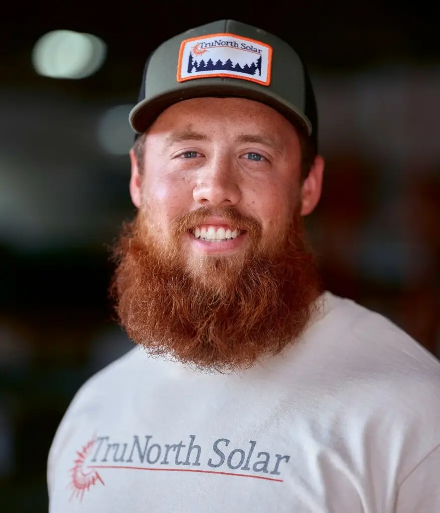 a man with a beard wearing a hat