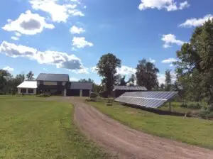 a house with solar panels in front of it