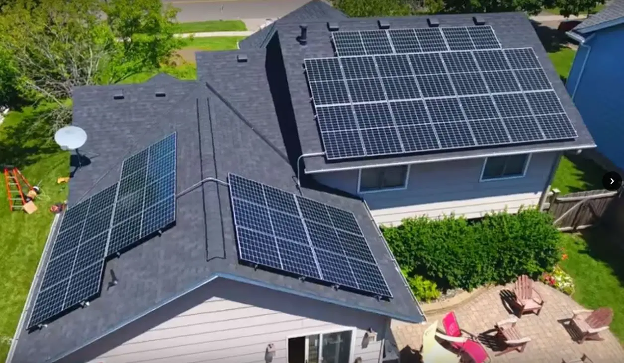 a house with solar panels on the roof