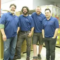 a group of men in blue polo shirts