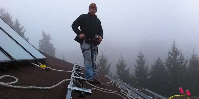 a man standing on a roof